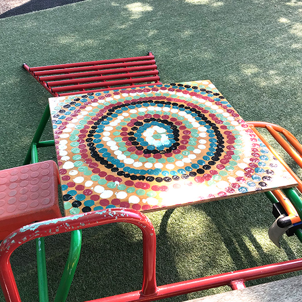 preschool project of painted table with aboriginal dots at kids korner