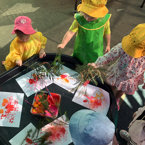 chldren painting with sticks and leaves at kids korner nowra occasional care