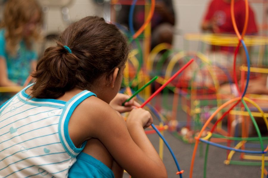 a girl learning through play